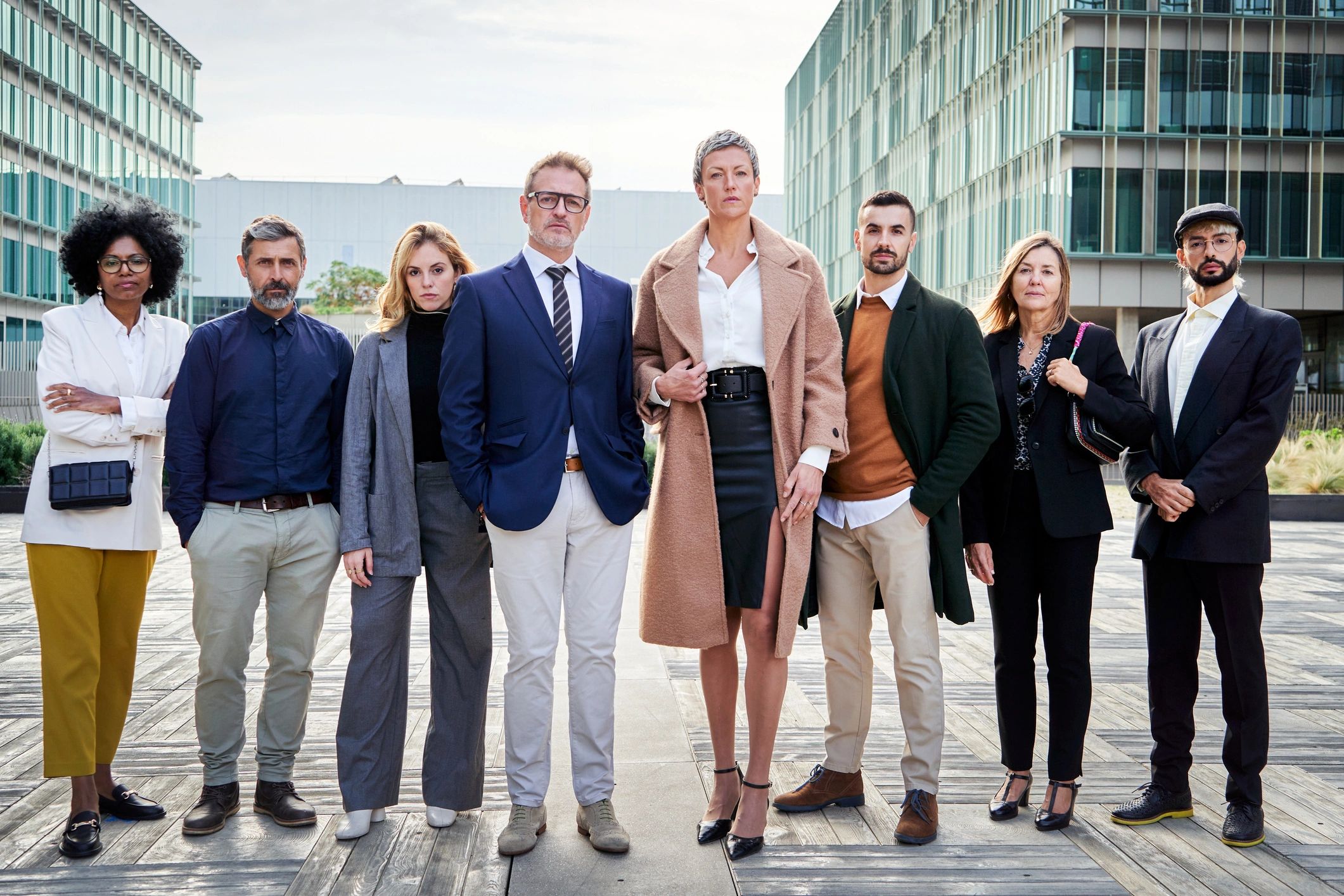 Professional team standing together in a clean modern business setting